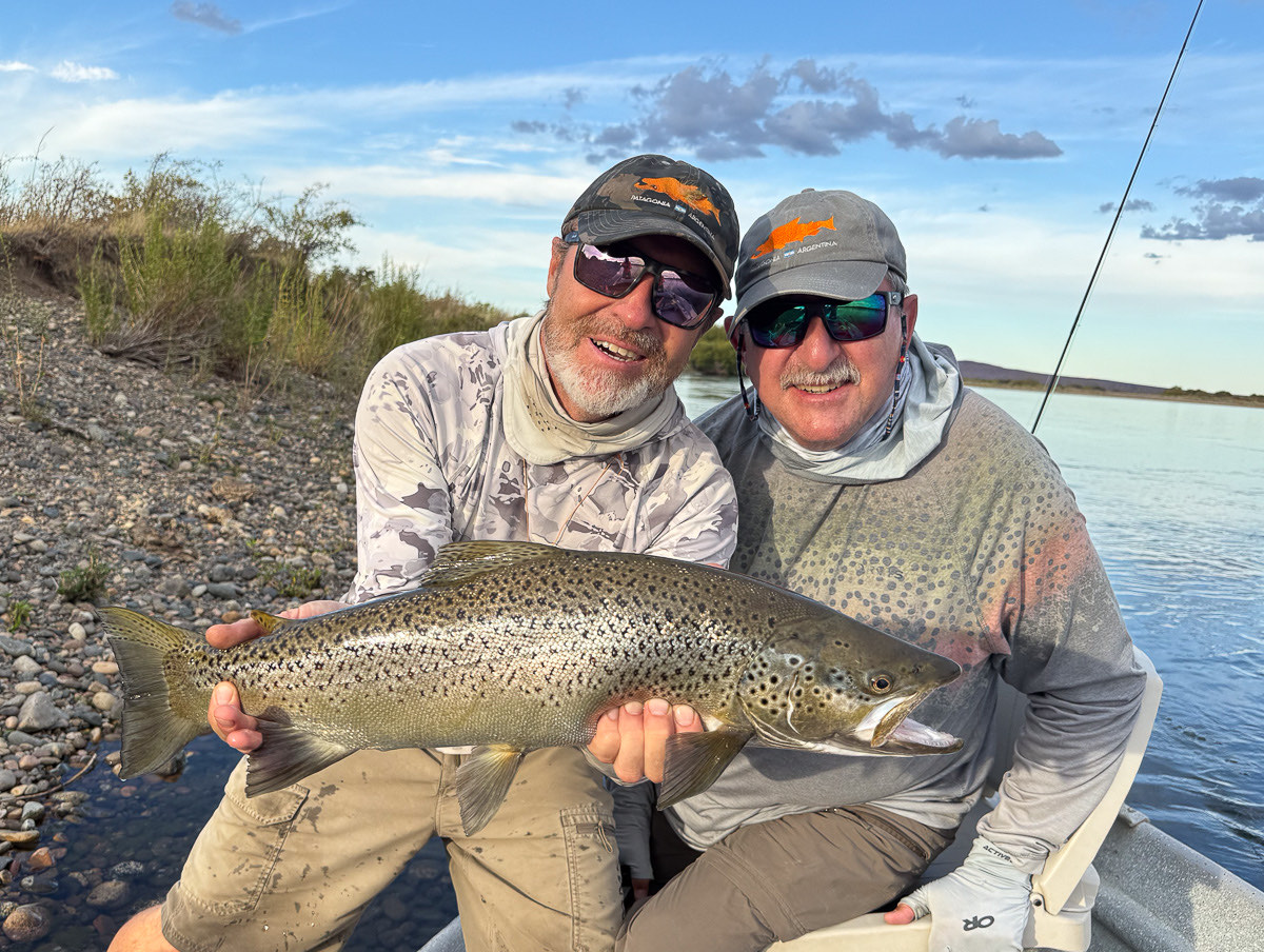 Angler holding a big brown trout from the Middle Limay River — click to open the fishing photo gallery