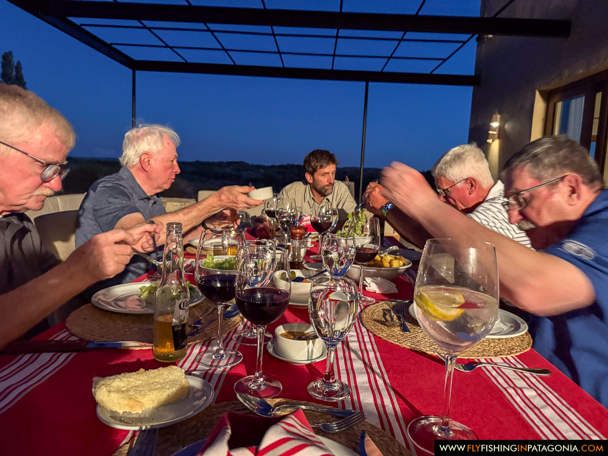 guests having dinner under the pergola at Limay River Lodge