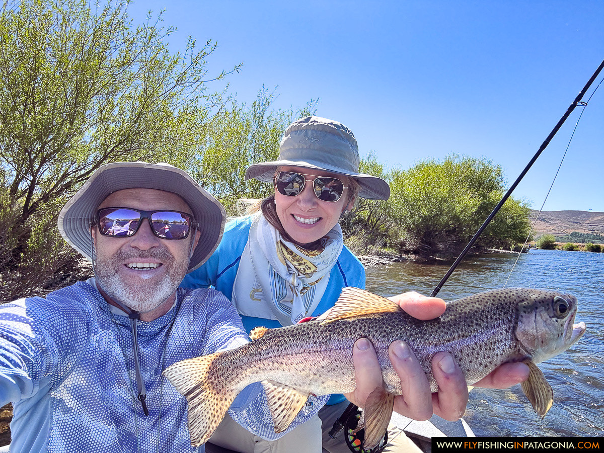 a happy couple with a nice rainbow trout on the Chimehuin River