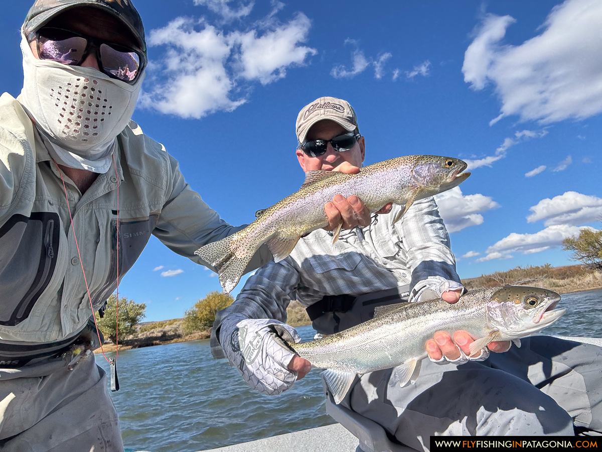 Two anglers holding trout after a day on the Collon Cura River