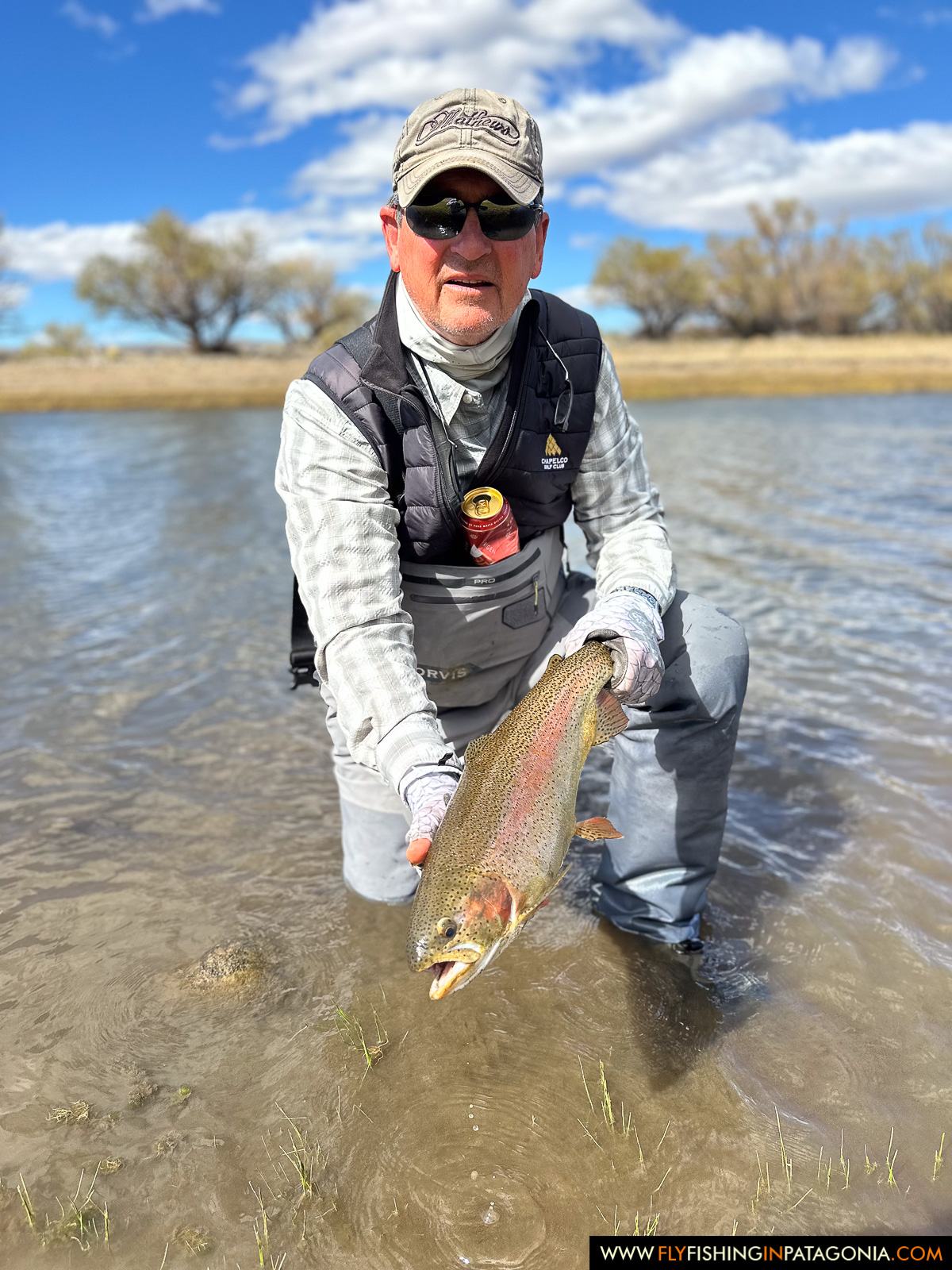 Angler releasing a brown trout in the Collon Cura River