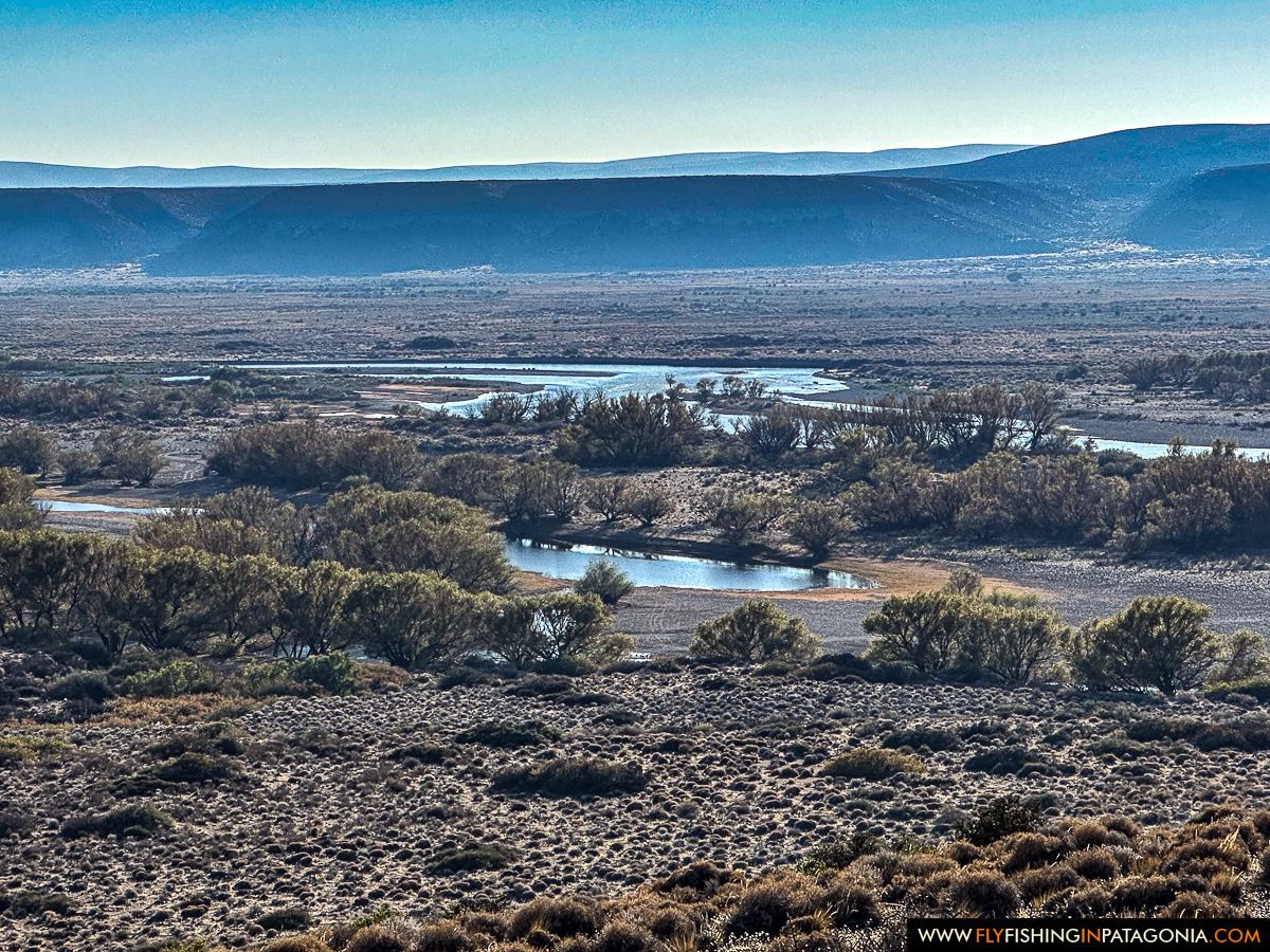 Panoramic view of the lower Collon Cura River winding through the Patagonian landscape