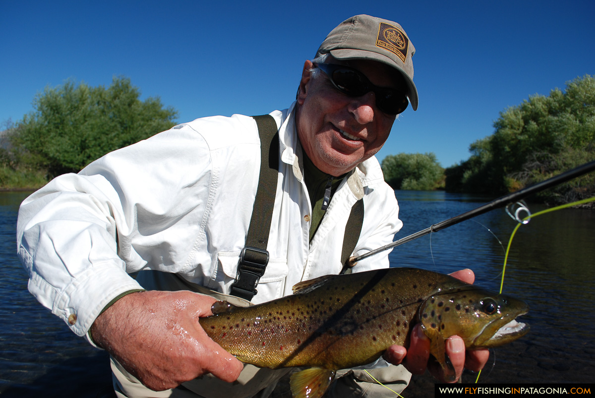 Art holding a brown trout from the Malleo River
