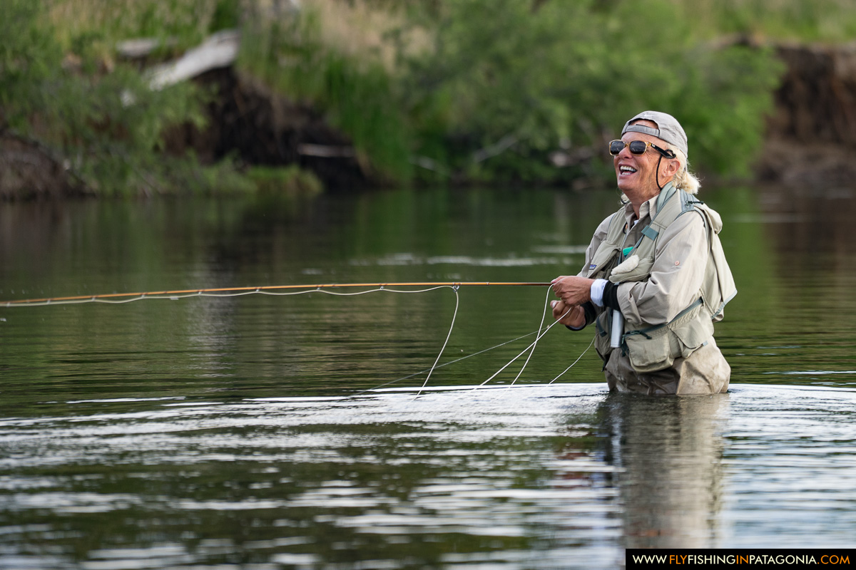Fly angler preparing a cast after spotting a trout in the Malleo River