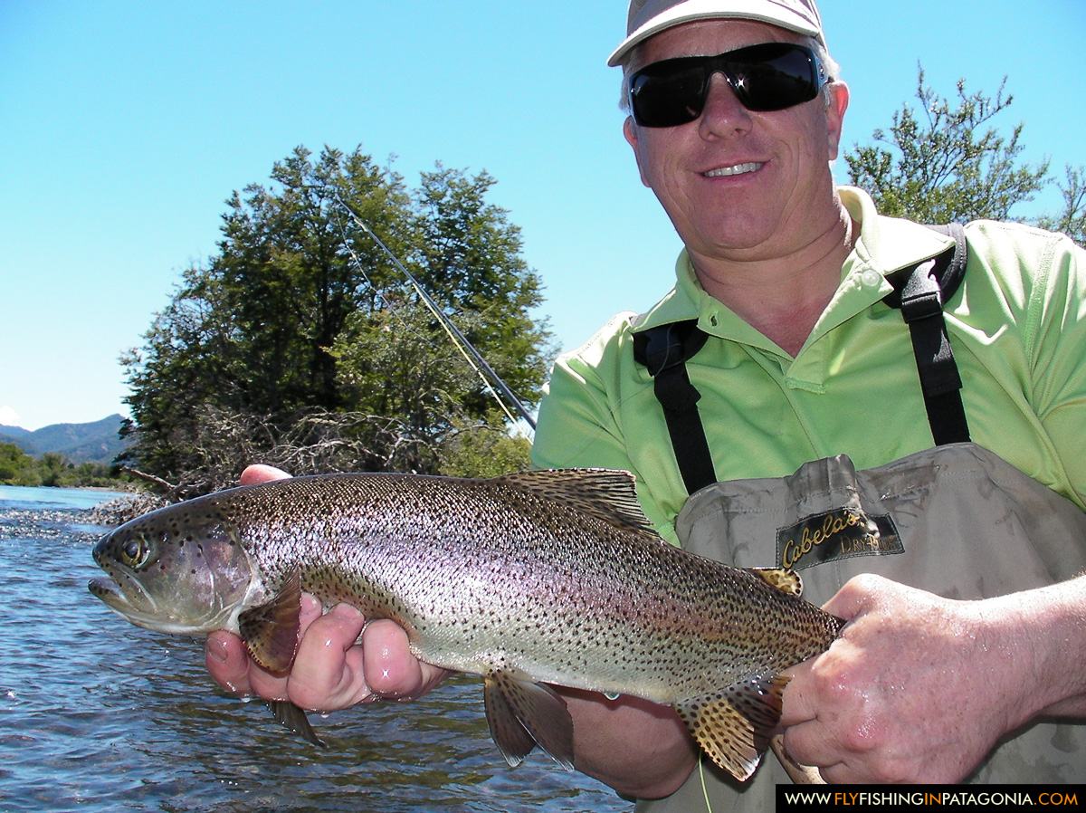 Greg LeMond holding a rainbow trout from the Malleo River