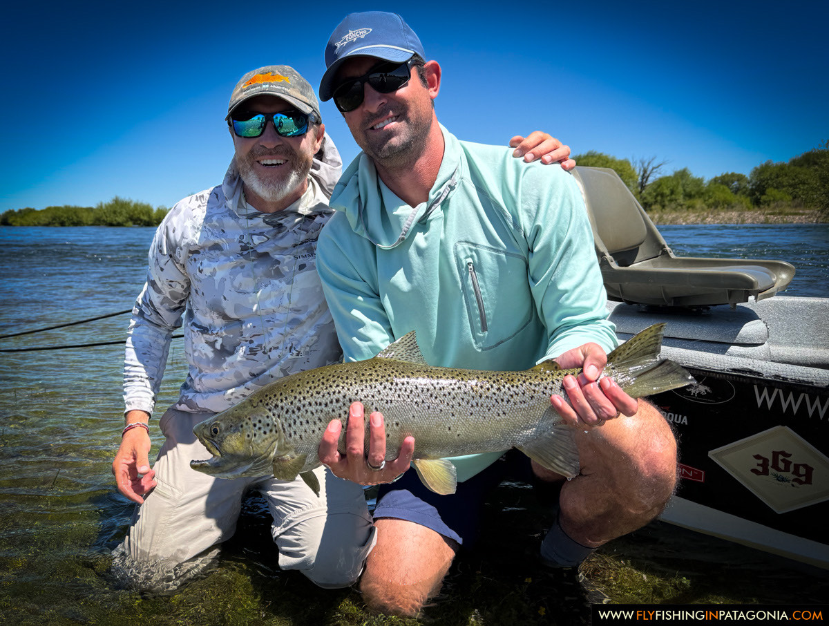 a happy angler with a gorgeous brown trout from the middle limay river