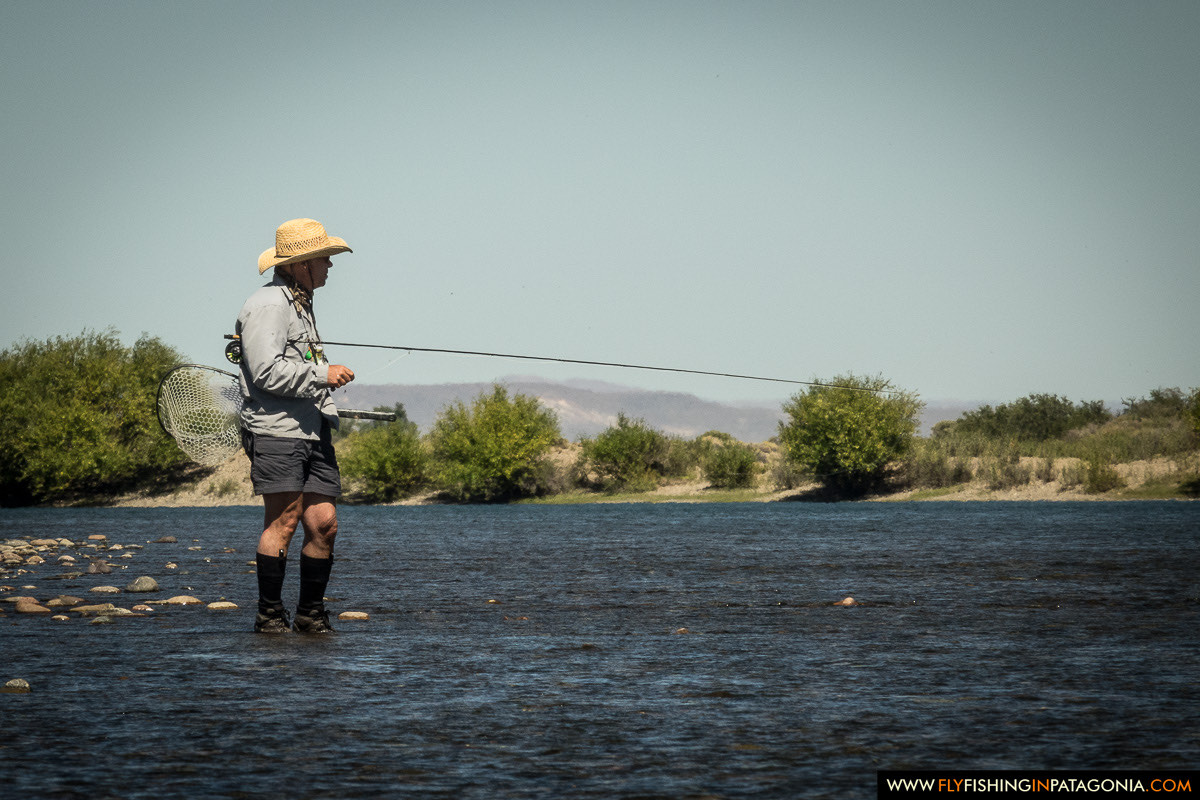 drifting the boat along the banks of the middle limay river