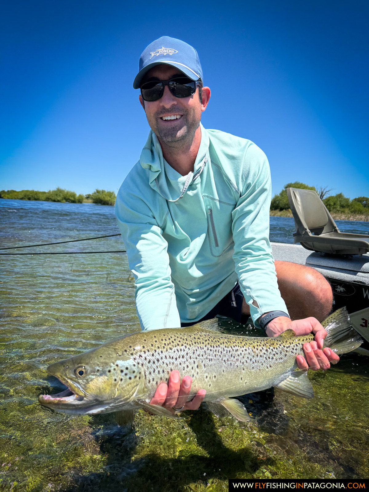 showing off a beautiful brown trout from the middle limay river