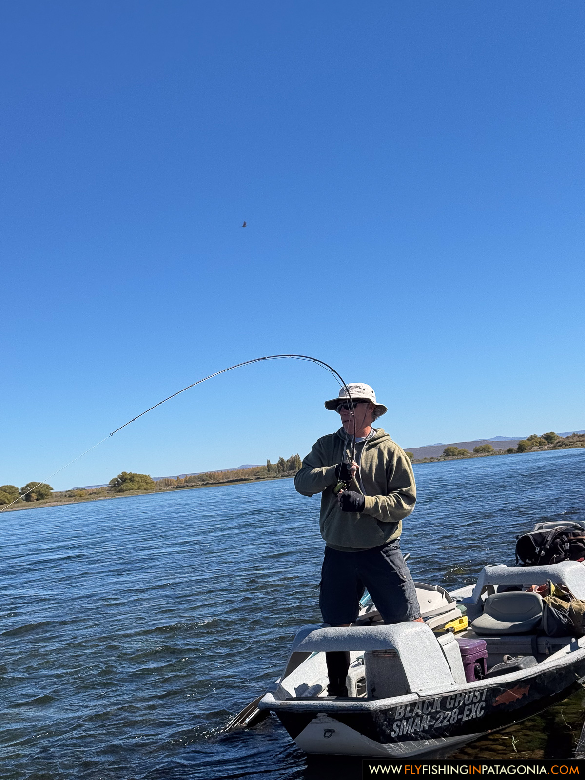 hooked up and fighting a fish from the bow of the boat on the middle limay river