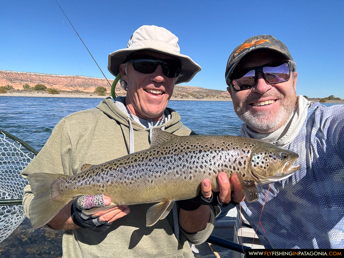 two anglers sharing a great brown trout catch on the middle limay river