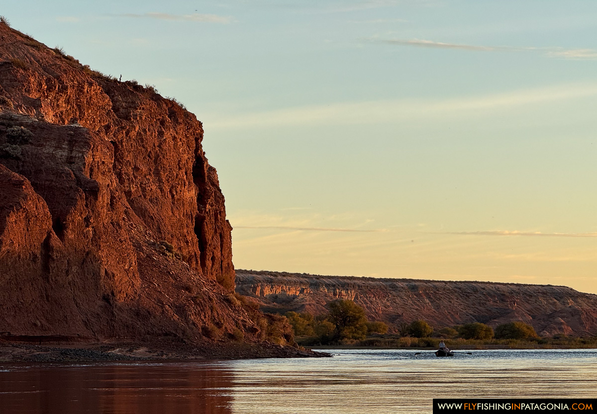the red cliffs glowing at sunset along the middle limay river