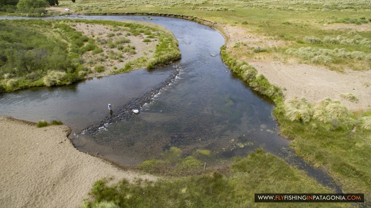 Aerial view of an angler fishing a bend of the Quemquemtreu stream