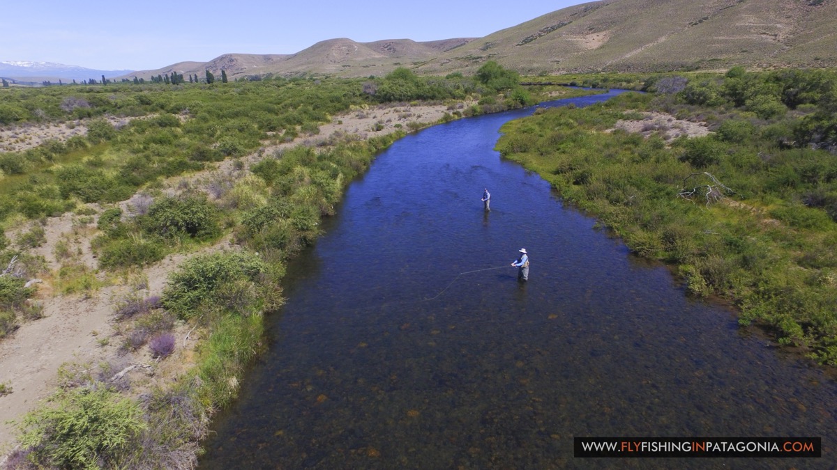 Aerial view of two anglers fishing a clear run of the Quemquemtreu stream