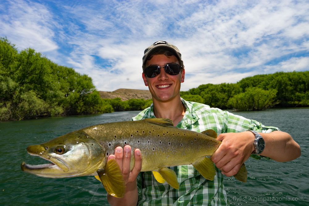 Lucas holding a 27inch brown from the Collon Cura River